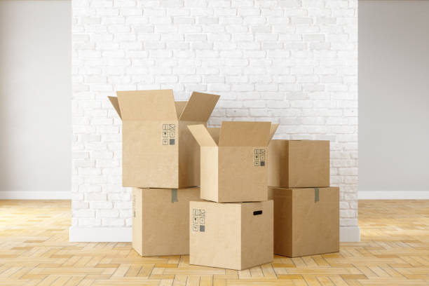 istock Cardboard Boxes In The Empty Room. Moving Home. 1220611983