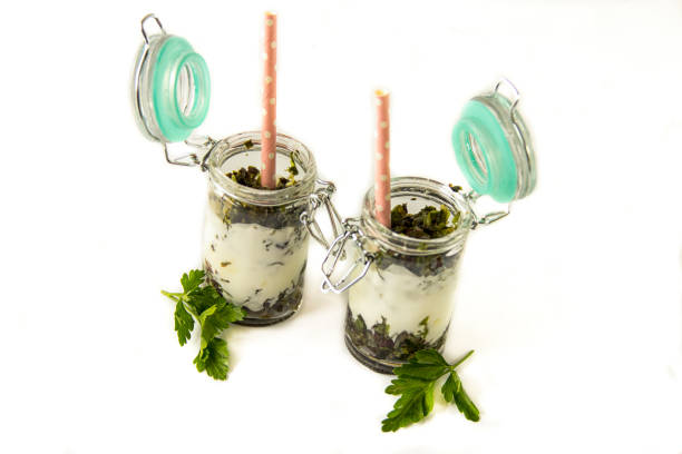 istock Healthy green smoothie with straw isolated on white 1220613311