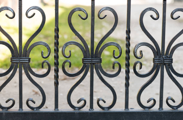 istock Black iron gate with flower and heart shape detail 1220619022