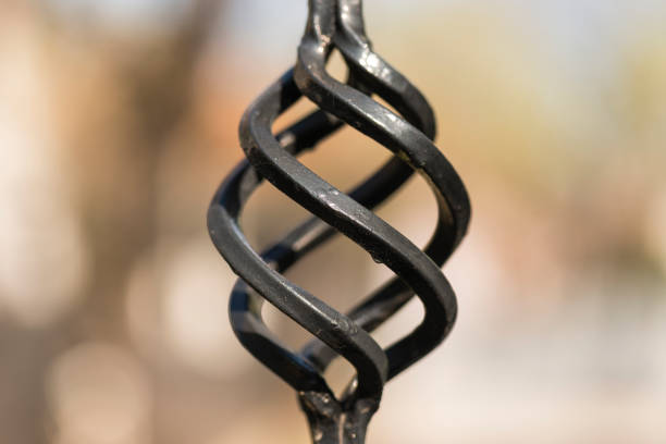 A beautiful curved detail on a black iron gate