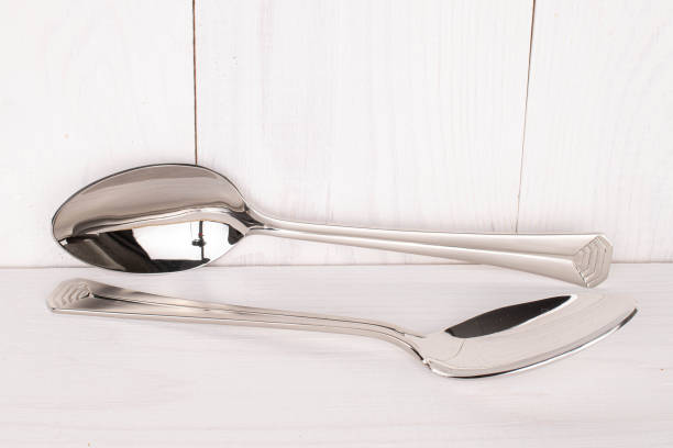 istock Steel cutlery on white wood 1220621701