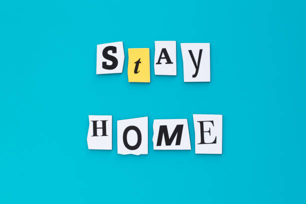 istock A word writing text - stay home. Cut letters on a turquoise background. Headline, banner with inscription. Coronavirus prevention, quarantine concept. 1220623415