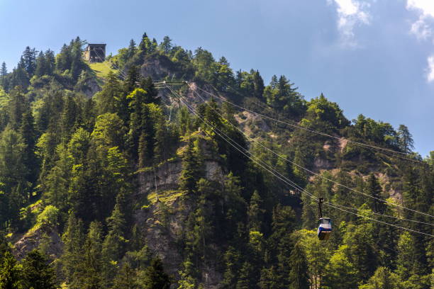 istock Gosaukammbahn cable car over Vorderer Gosausee lake under Donnerkogel Mountain in Gosau, Austria 1220623507