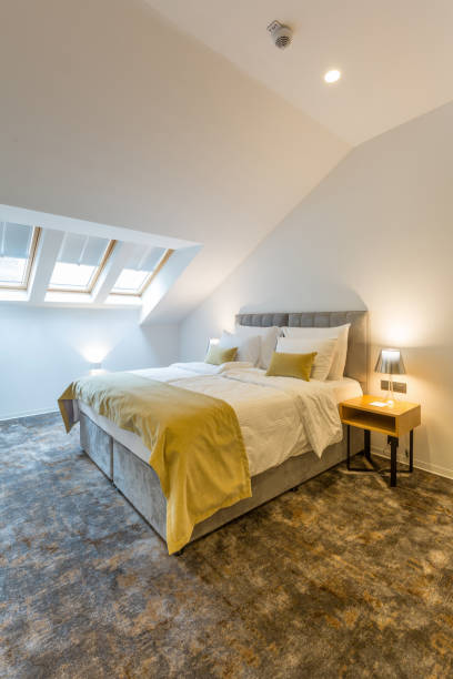 istock Interior of a loft double bed hotel bedroom 1220624522