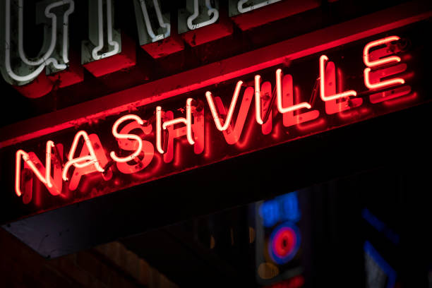 Neon sign in Nashville Tennessee USA Nashville music city colorful neon sign hanging on Broadway in downtown Nashville Tennessee USA popular music concert photos stock pictures, royalty-free photos & images