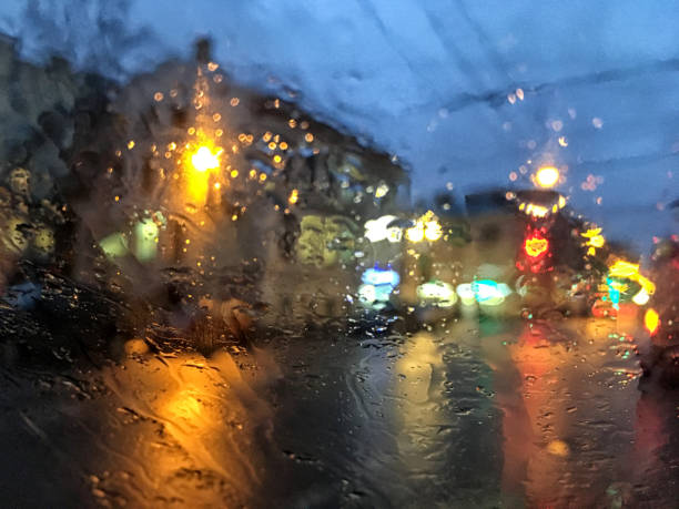 istock Road view through car window blurry with heavy rain. 1220625432
