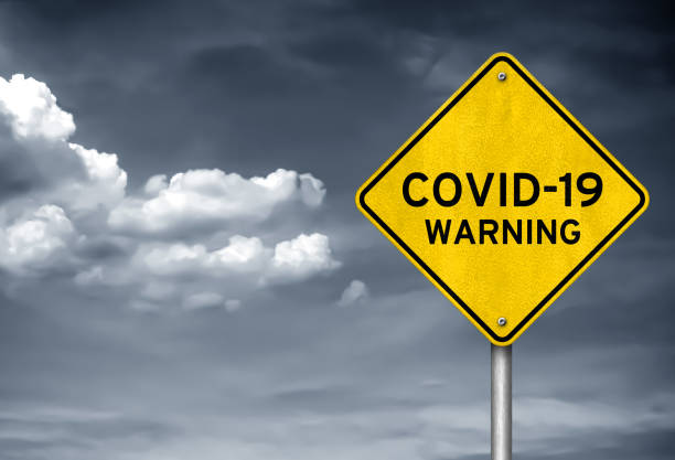 istock Coronavirus warning as roadsign infomation 1220625467