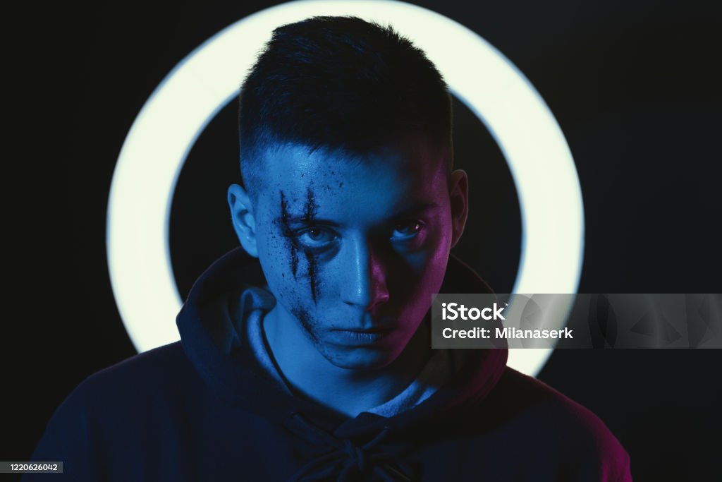 Teenage boy with wounds on face for book cover and poster ideas Teenage boy with wounds on face for book cover and poster ideas. Adult Stock Photo