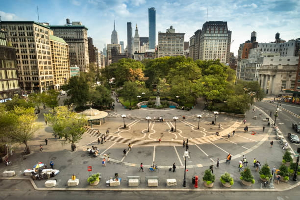 Union Square Park in midtown Manhattan New York City USA Aerial view of people walking through the plaza of Union Square Park in midtown Manhattan New York City USA union square new york city stock pictures, royalty-free photos & images