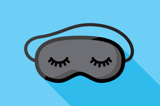 Sleeping Mask Flat Vector illustration of a black sleeping mask with stylized eyes and eyelashes against a blue background in flat style. bedtime illustrations stock illustrations