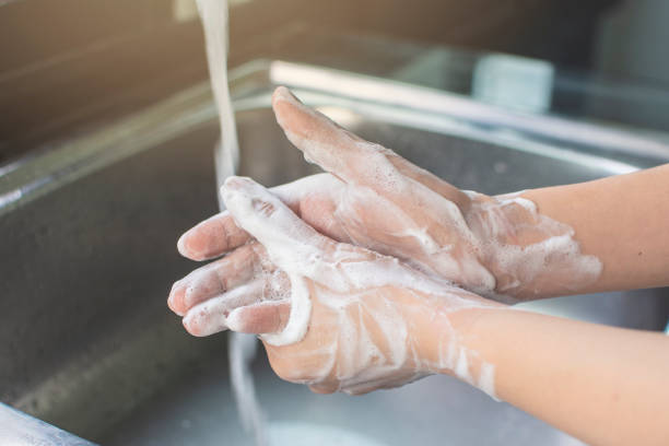istock Woman hand washing with soap antibacterial. 1220630673