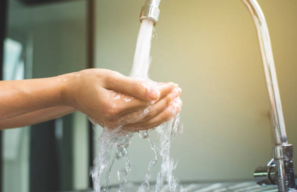 istock Woman hand washing with soap antibacterial. 1220630682
