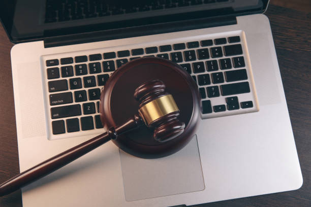 istock Gavel with books and scales on brown background 1220630821