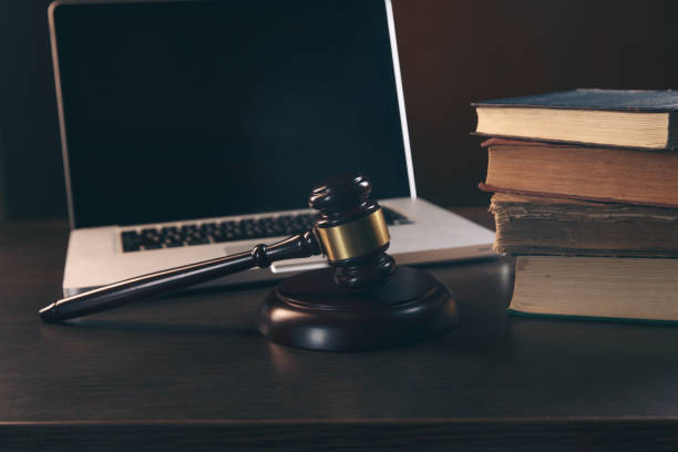 istock Gavel with books and scales on brown background 1220631064