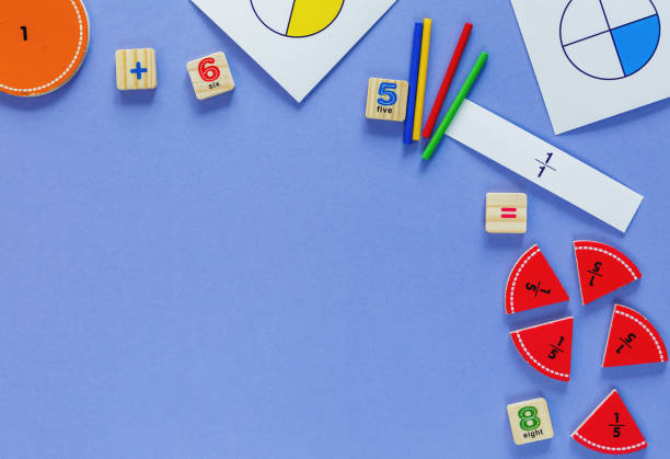 istock Creative math fractions on violet background. Interesting funny math for kids. Education, back to school concept. Geometry and mathematics materials. Flat lay, top view 1220632194