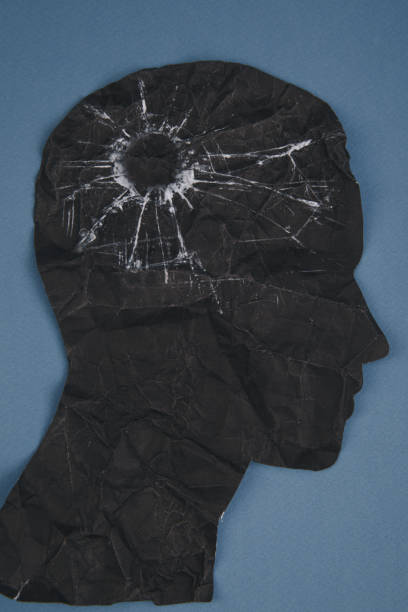 istock Brain disorder symbol presented by human head made form paper . Creative idea for Alzheimer's disease, dementia, memory loss and mental 1220633447