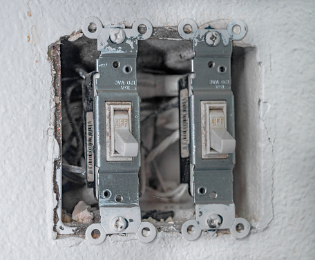 Two old Toggle Light Switches that need replaced.