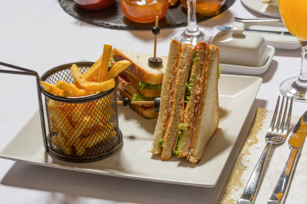 istock Club sandwich served on white plate in the restaurant 1220635420