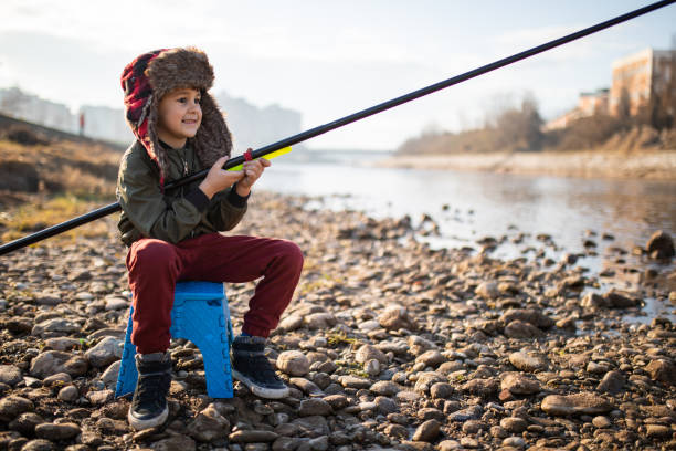 istock A boy with a fishing rod 1220638603