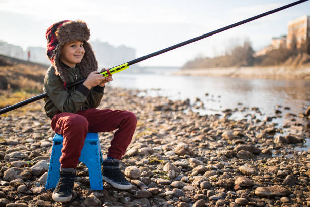 istock A cute boy fishing 1220638605