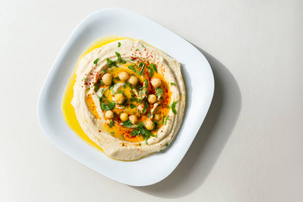 Homemade Hummus Homemade hummus -  chickpea spread with tahini. hummus stock pictures, royalty-free photos & images