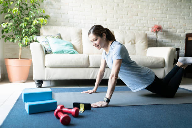 istock Working out with online exercises on a smartphone 1220640181