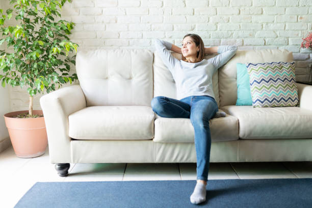 istock Brunette woman relaxing and enjoying home 1220641237