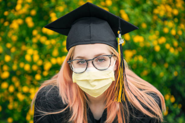 istock Graduate in Cap and Pandemic Face Mask 1220641561