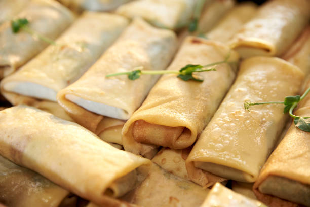 istock Lots of fried pancakes wrapped with stuffing 1220641896