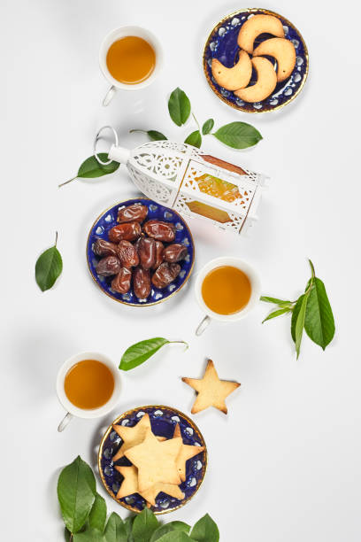istock Iftar foods on white table. Traditional middle-eastern lunch with cookies and sweets 1220642006