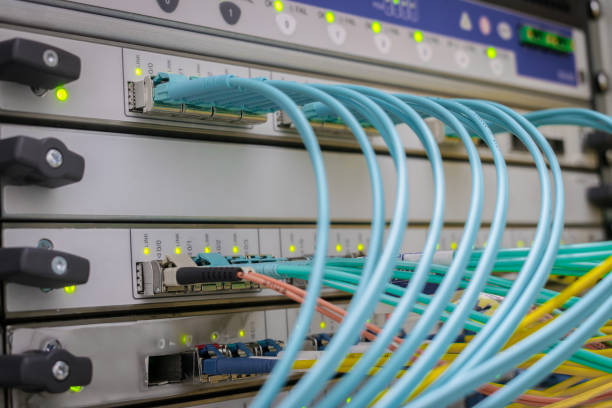 istock The main communication links are in the datacenter. The front panel of the Central router has many fiber-optic wires. High-speed Internet switch interfaces are in the server room. 1220642150