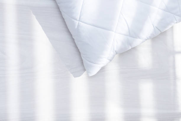 istock White hypoallergenic pillow in sunny day, sunlight. Allergy dust mite concept. 1220642274
