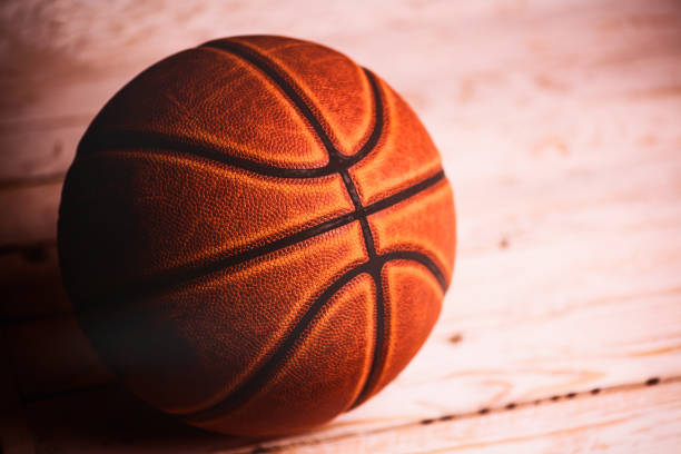 istock basketball ball on wooden background. 1220643332
