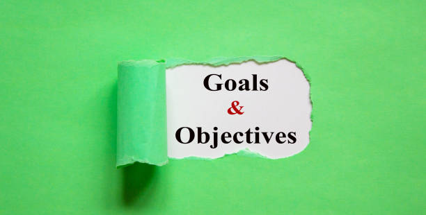 istock The text 'Goals and objectives' appearing behind torn green paper. 1220643986