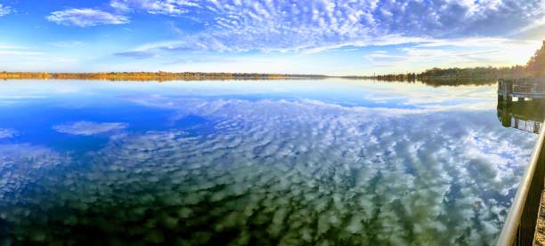 istock Reflection of Blue Sky and Still Glass Like Lake 1220644629