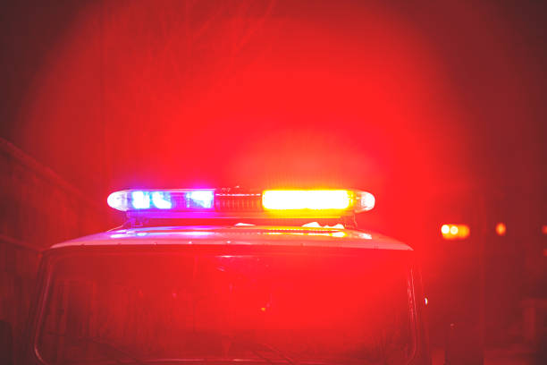 istock policeman car lights at night 1220645397