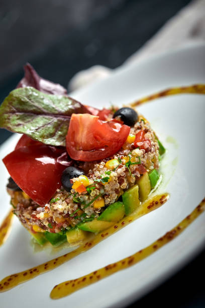 istock Delicious quinoa salad with avocado and tomatoes. Macro 1220645923