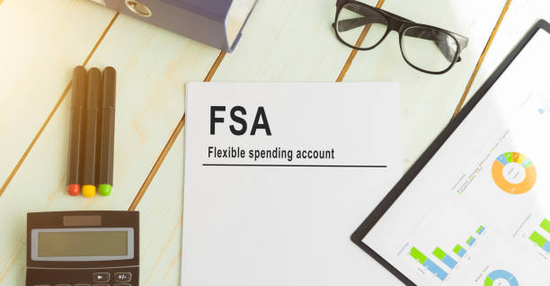 Papers with flexible spending account FSA on a table, business concept. Papers with flexible spending account FSA on a table, business concept. free syrian army stock pictures, royalty-free photos & images