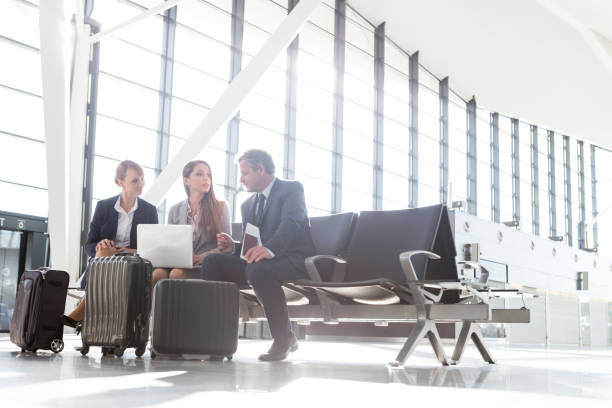 istock Business people working while waiting for boarding in the airport 1220648685