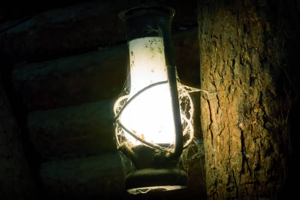 istock Miner's Lamp in s Dark Mine on a Wood 1220648811