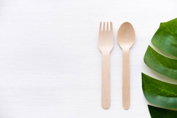 istock eco friendly disposable kitchenware utensils on white background. wooden forks and spoons. ecology, zero waste concept. top view. flat lay. copyspace 1220651042
