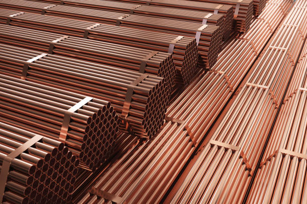 istock Stack of copper pipes in warehouse. Rolled metal products. 1220653149