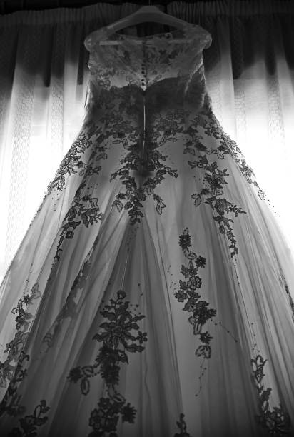 istock Wedding dress hanging 1220653493
