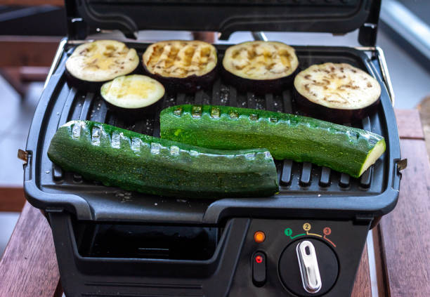 istock zucchini and eggplant cooking on electric grill 1220653562