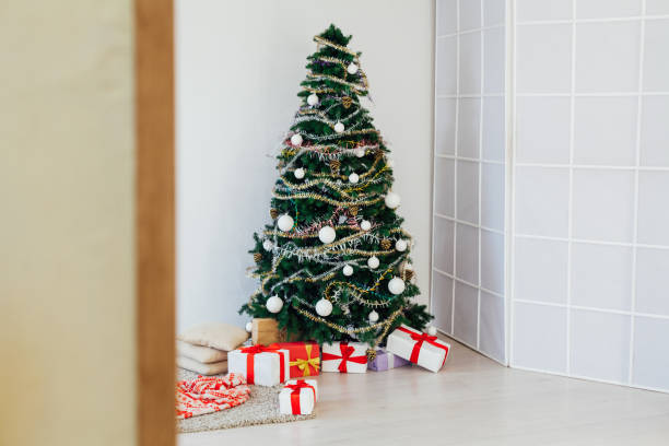 istock Christmas decoration Christmas tree new year presents holiday interior 1220654200