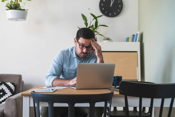 istock Young businessman having some problems while working at home stock photo 1220656199