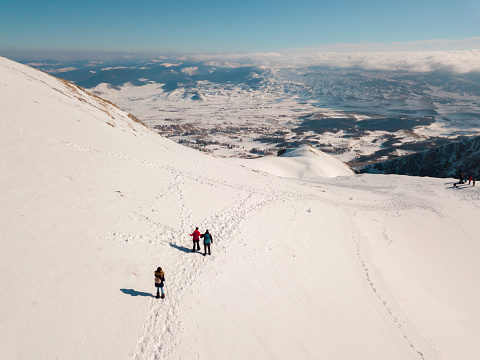 Panoramic view from Durmitor mountain peak Savin Kuk and 3 hikers