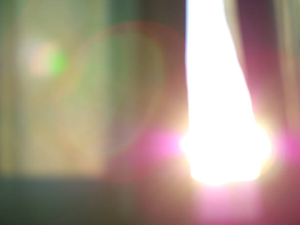 istock Dramatic light leak through green curtain bokeh 1220659823