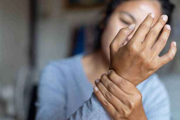 istock young woman wrist pain 1220662821