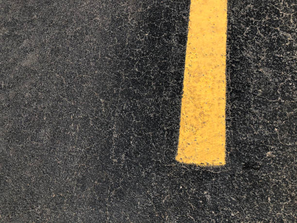 istock Close Up of Yellow Line on Highway 1220666025